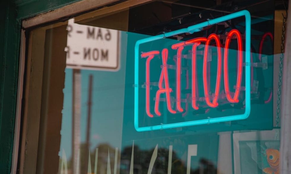 tattoo neon sign in window