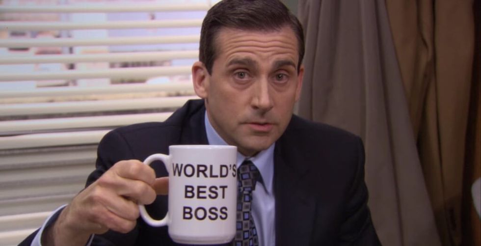 Steve Carrell in The Office holding a World's Greatest Boss mug