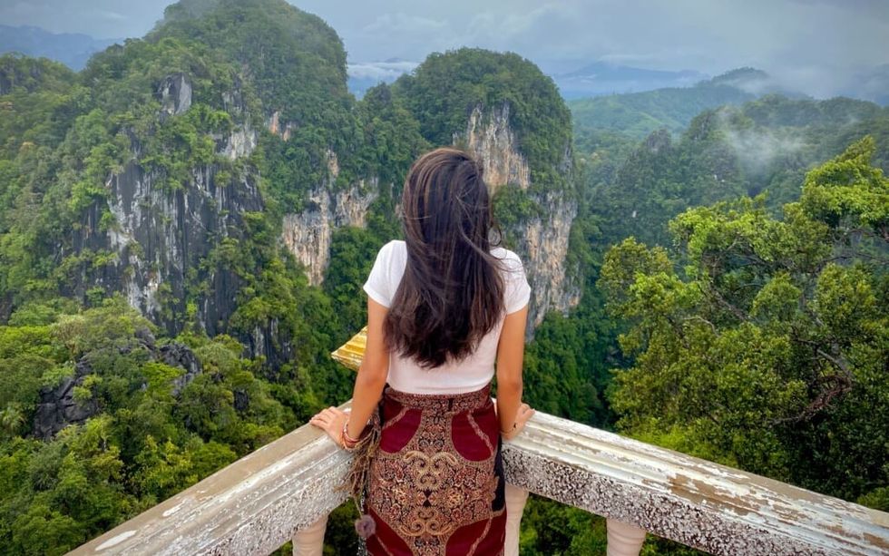 young woman enjoys a stunning view
