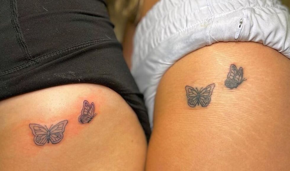sisters of matching butterfly tattoos