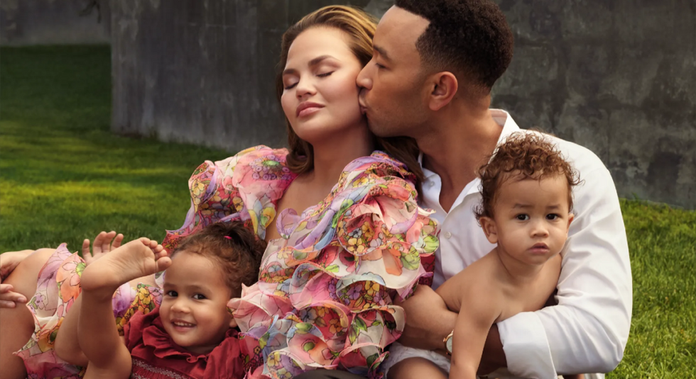 Chrissy Teigen and John Legend with their children in family photo.