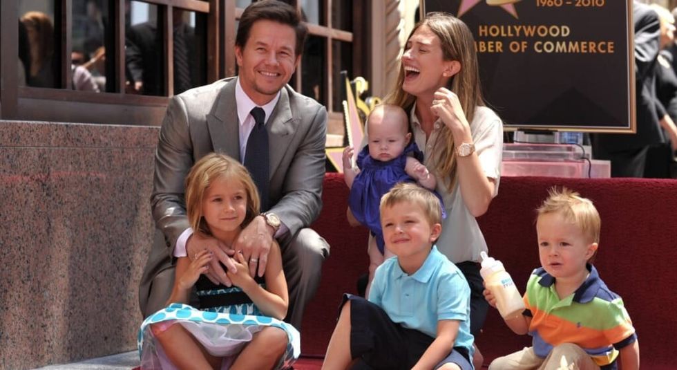 Mark Wahlberg with wife and four young kids on Hollywood star.