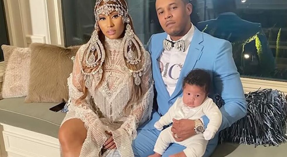 Nicki Minaj wearing elaborate white dress with newborn son and dad, Kenneth Perry.