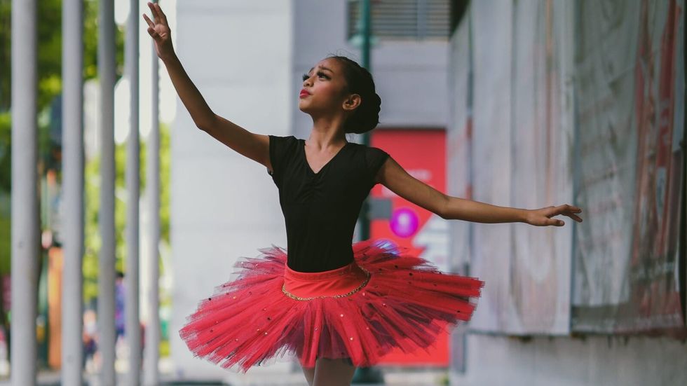 ballet dancer in red tutu skirt