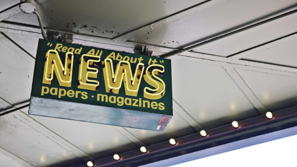 a neon sign with "news" on it