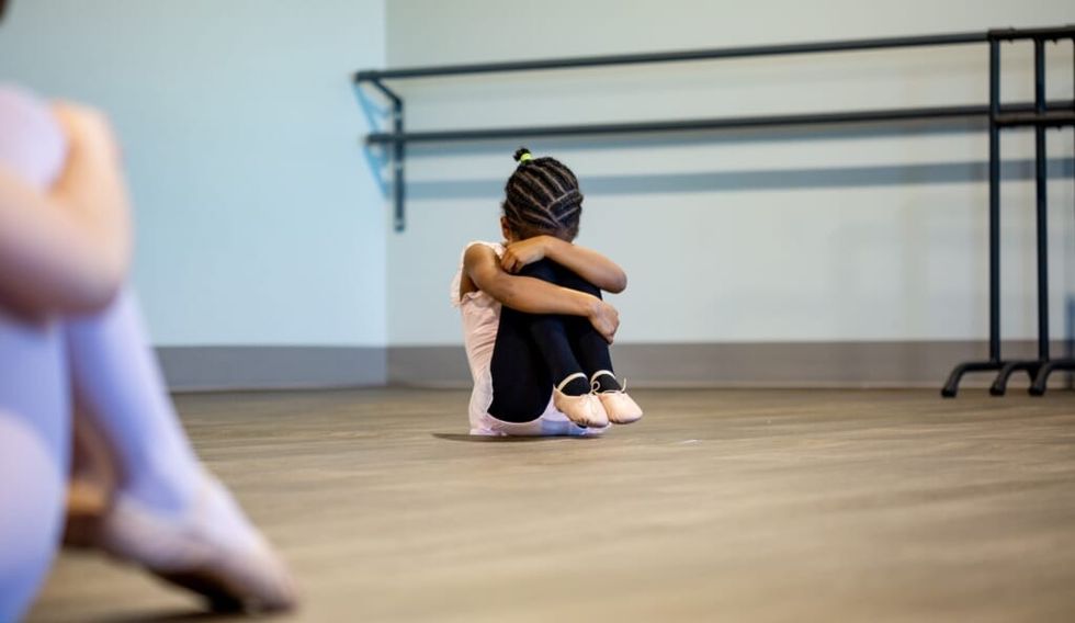 young girl is upset at dance class