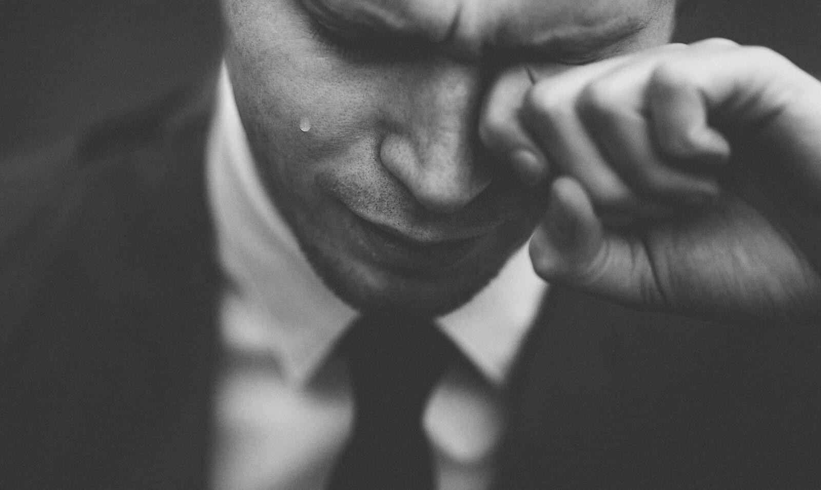 man cries black and white photo