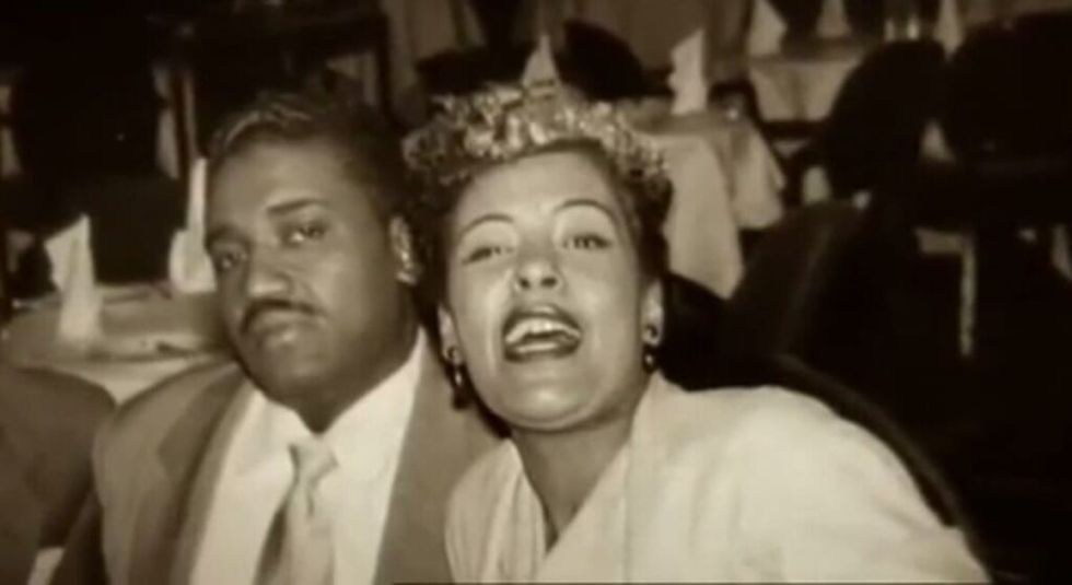 Billie Holiday with husband Louis Mckay at a restaurant. 