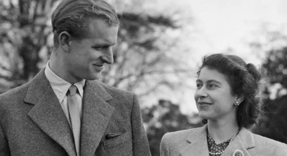 Black and white photo of a young Queen Elizabeth with Prince Philip