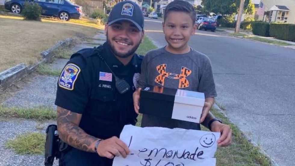 cop buys shoes for boy selling lemonade