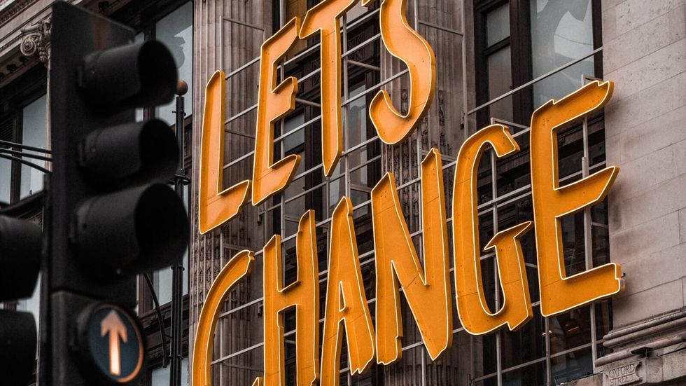 "lets change" marquee placed on the outside of a building