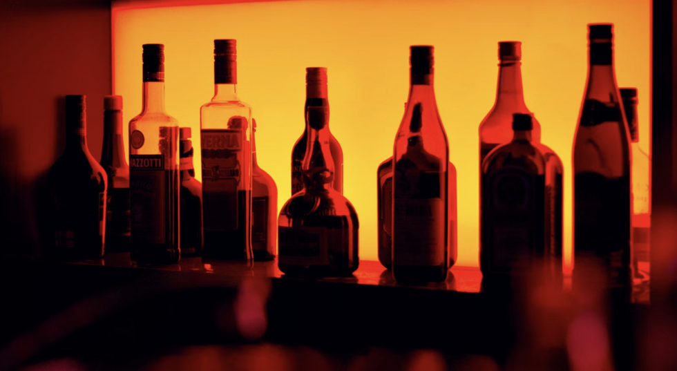 bottles at a bar yellow light