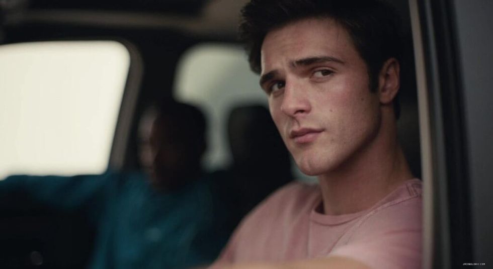 Jacob Eldi as Nate Jacobs sitting in a car looking out the window.
