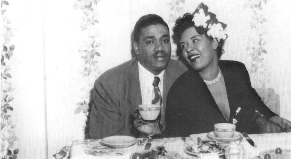 Billie Holiday and husband Louis McKay at the dinner table.