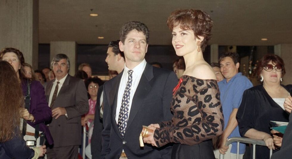 Sigourney Weaver and husband Jim Simpson in the 80s at a black tie event.