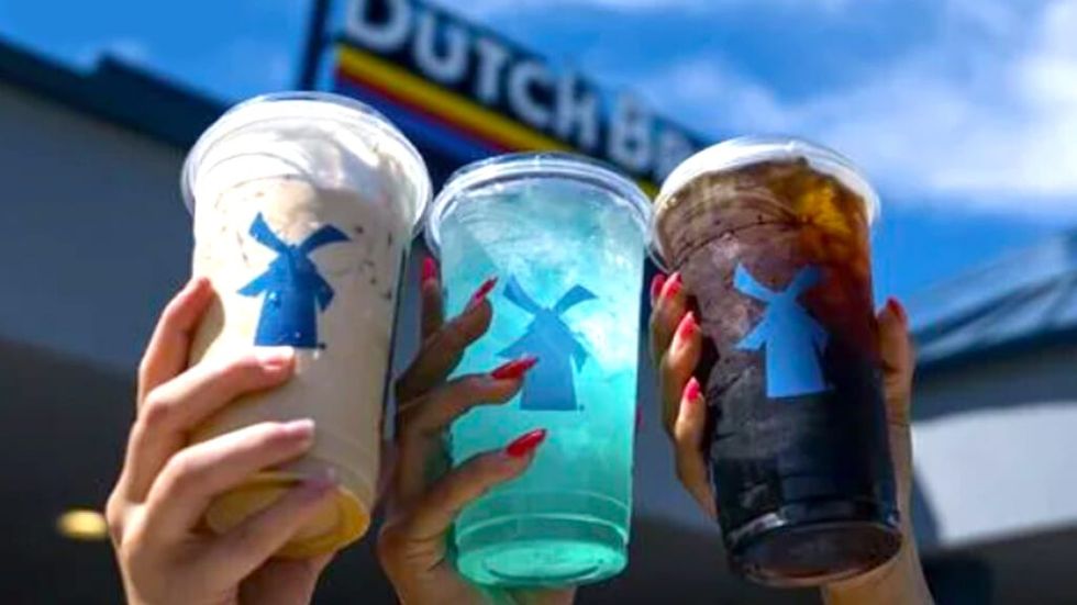 Dutch Bros. cusstomers holding up different drinks