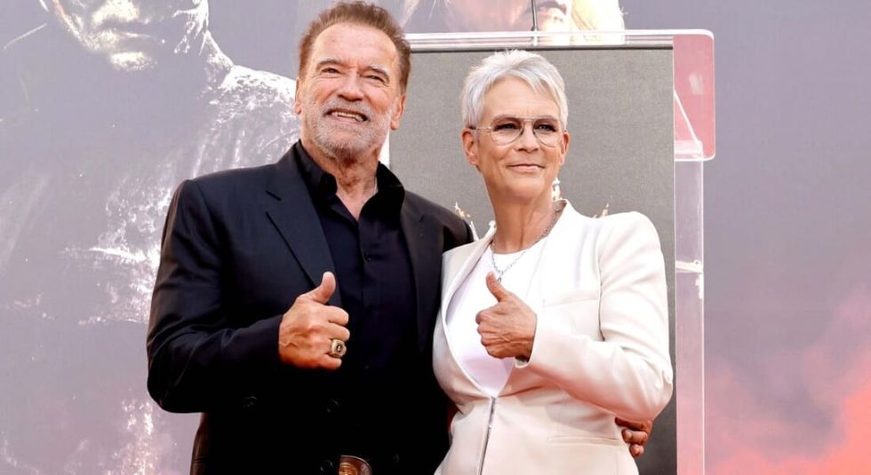 Jamie Lee Curtis and Arnold Schwarzenegger giving the thumbs up at the "True Lies" reunion.