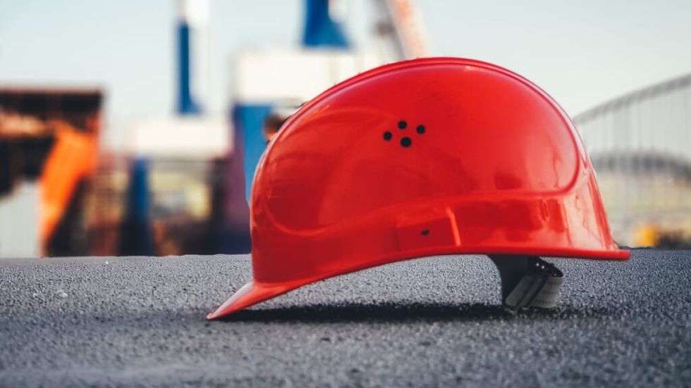 Orange safety helmet at a construction site