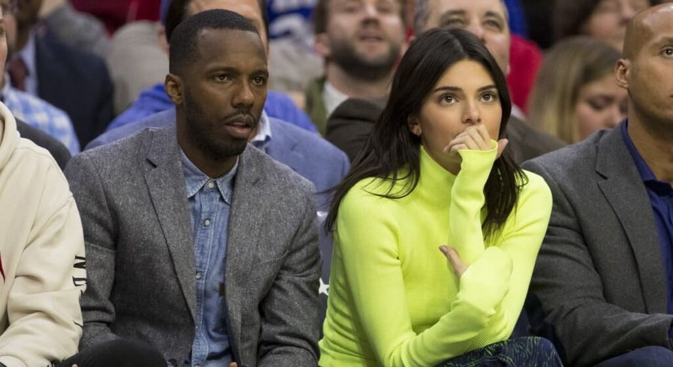 Rich Paul sitting next to Kendall Jenner during a basketball game.