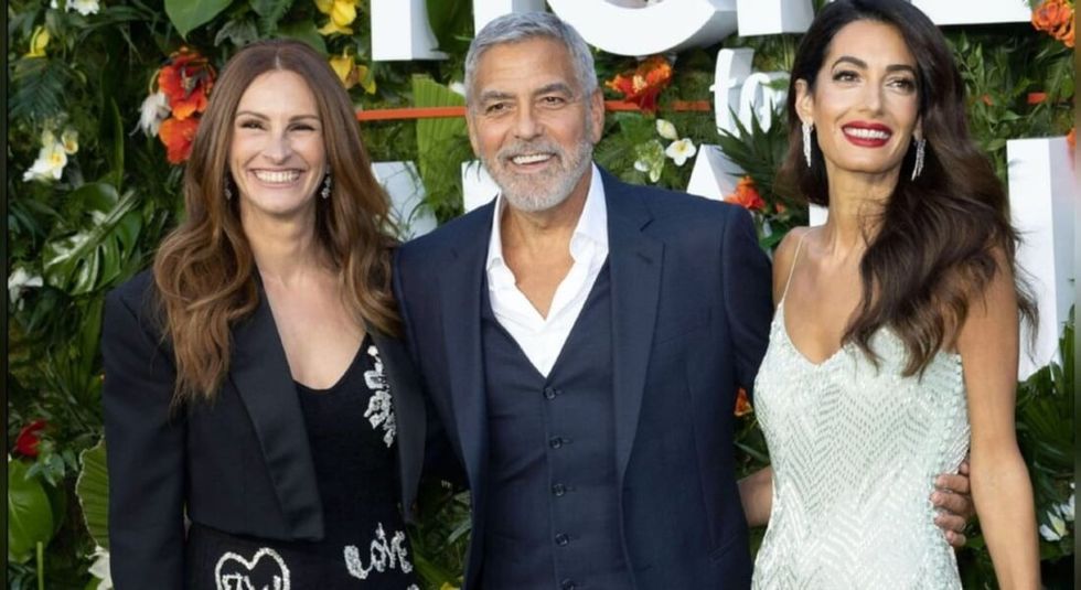 Julia Roberts, George Clooney and wife Amal on the red carpet.