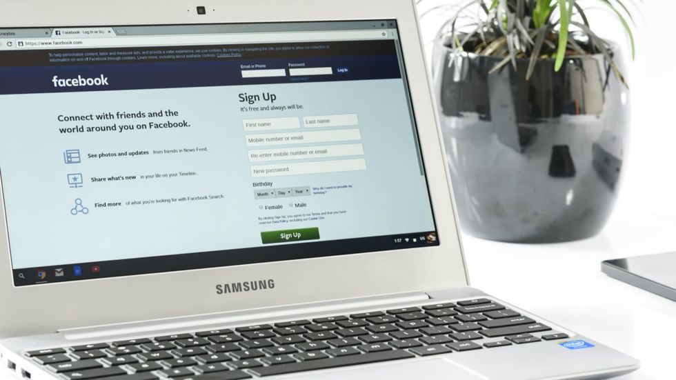 laptop with facebook opened on it