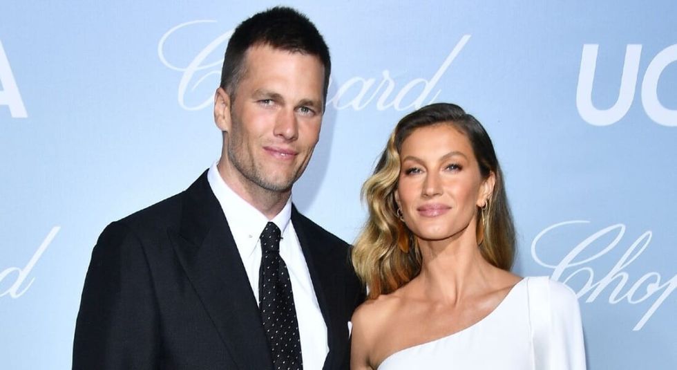 Tom Brady in a black suit with ex-wife Gisele in a white dress on the red carpet