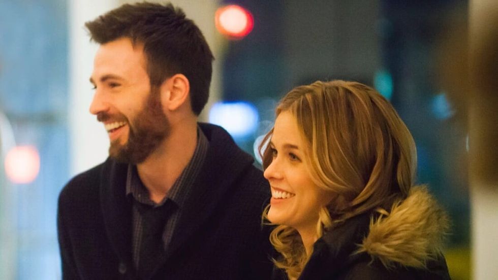 Chris Evans and Alice Eve laughing while on set.