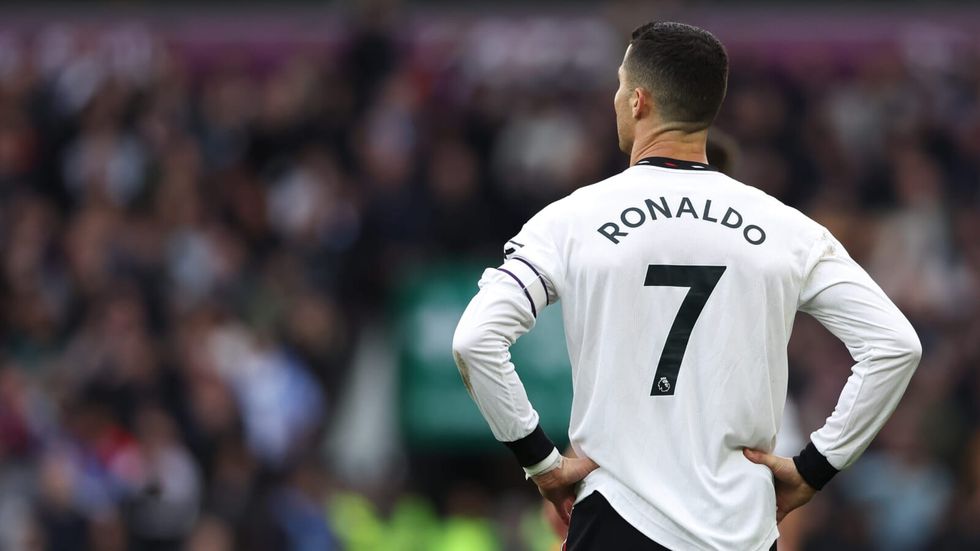 man wearing a white jersey with "ronaldo" written at the back