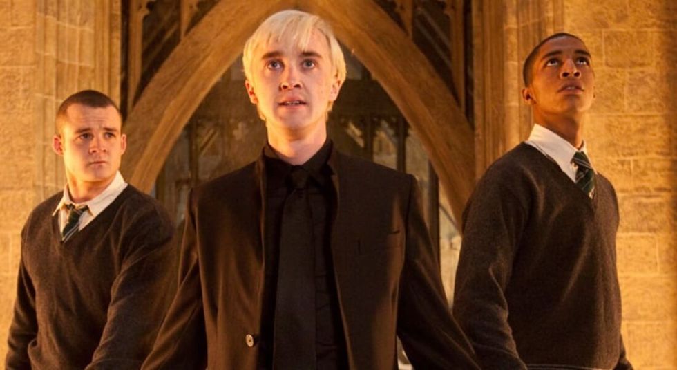 Tom Felton in Harry Potter And The Deathly Gallows wearing all black and looking powerful.