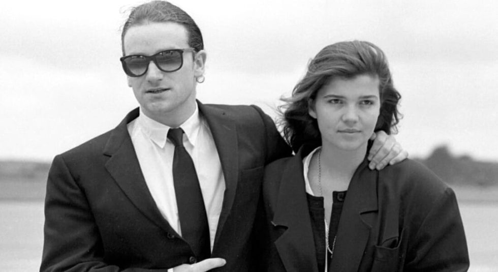 Black and white photo of a young Bono and wife Ali Hewson.