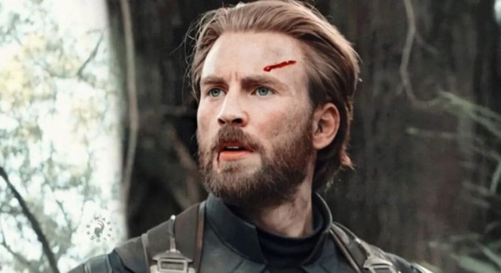 Chris Evans as Captain America with a cut on his head.