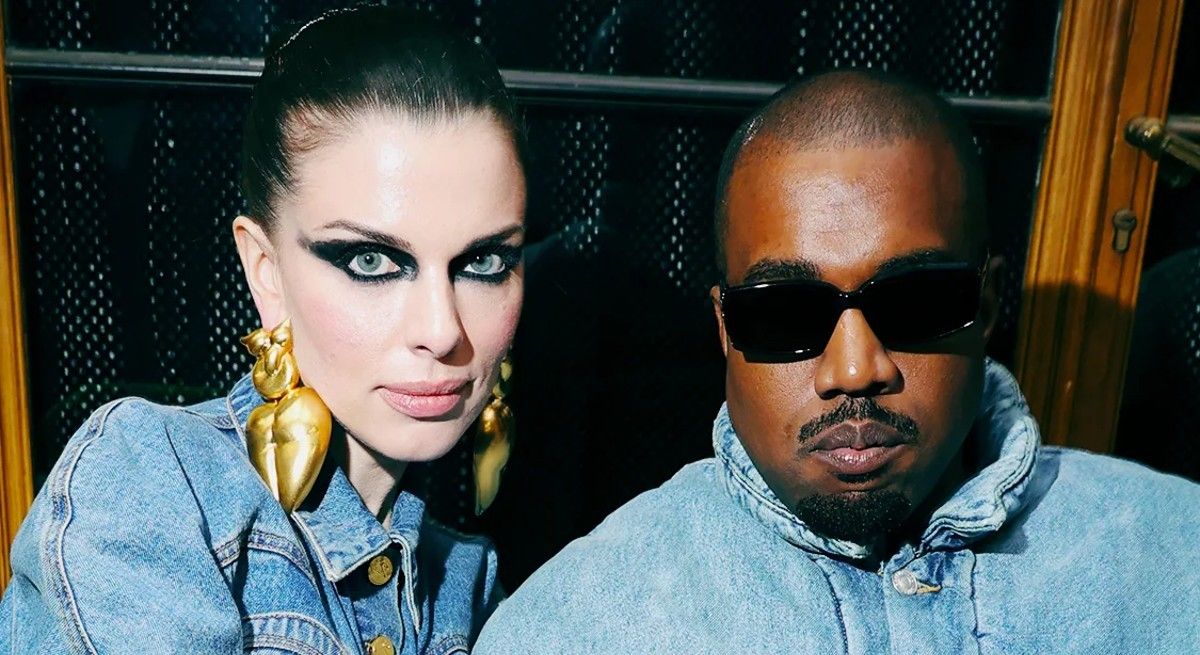 Julia Fox and Kanye west in matching jean outfits taking a break.