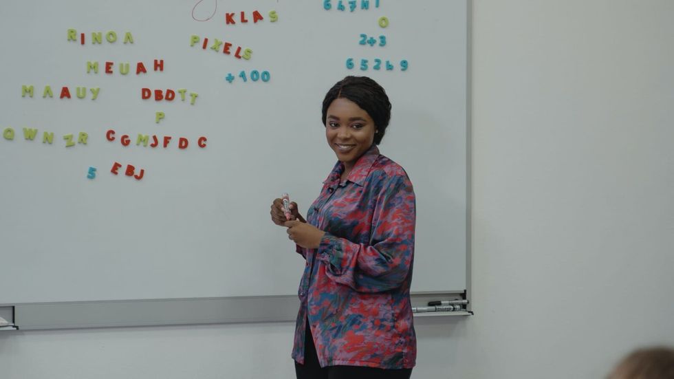 woman in front of a whiteboard