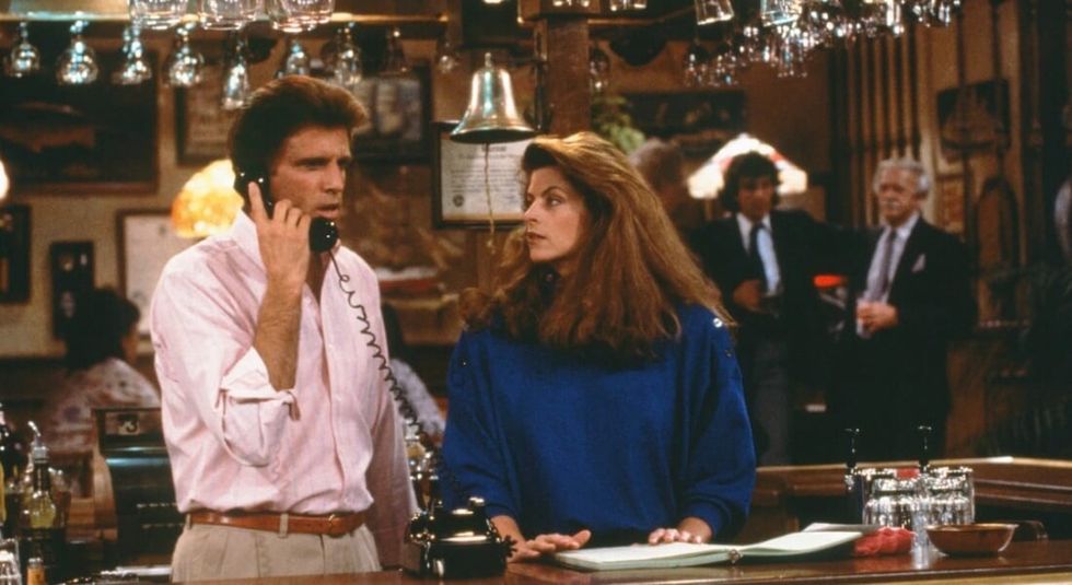 Kirstie Alley and Ted Danson acting in Cheers.