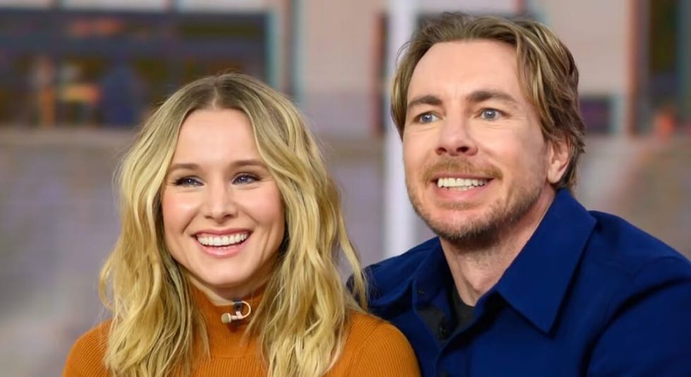 Kristen Bell and Dax Shepard smiling during an interview.