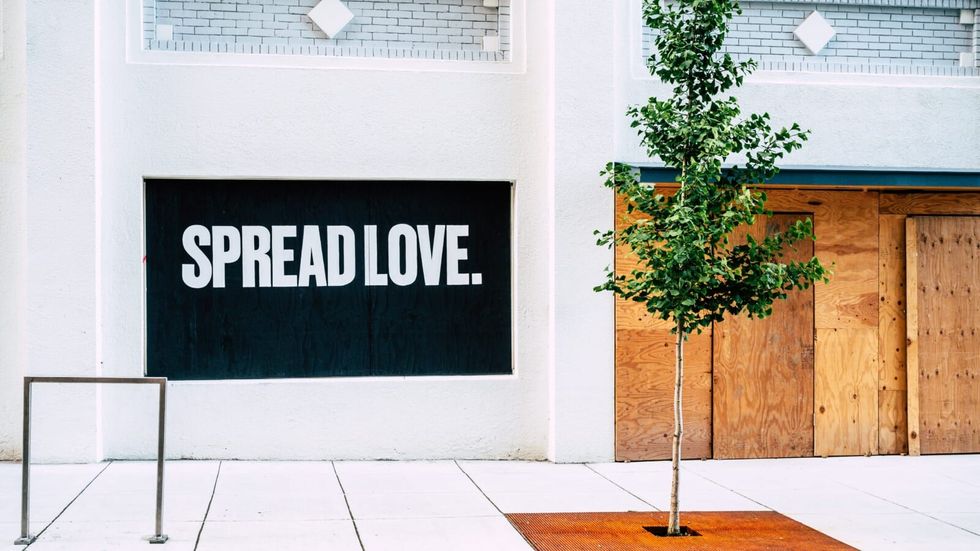 "spread love" written outside a building