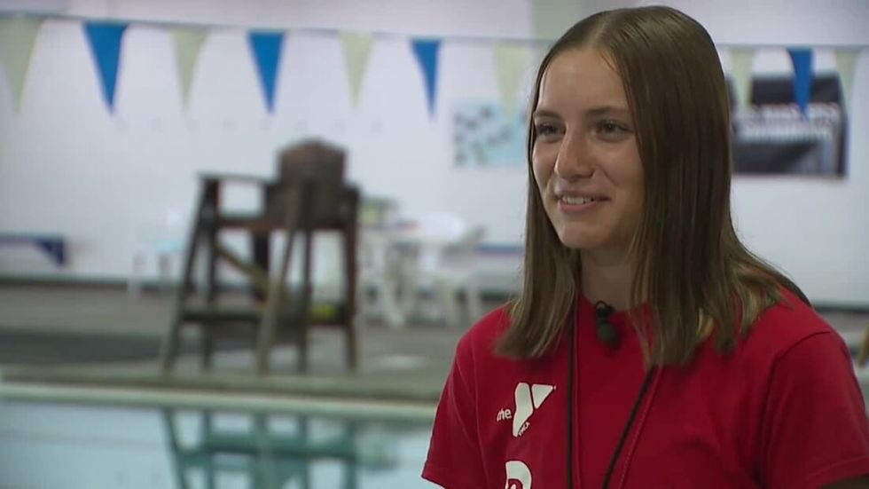 Lifeguard Assists Swimmer—as She Gives Birth On The Pool Deck Goalcast