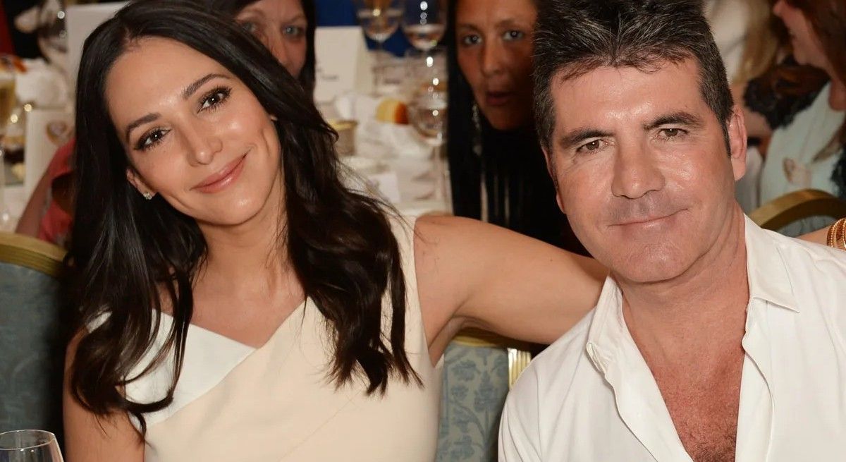 Simon Cowell and wife Lauren Silverman dressed in white.