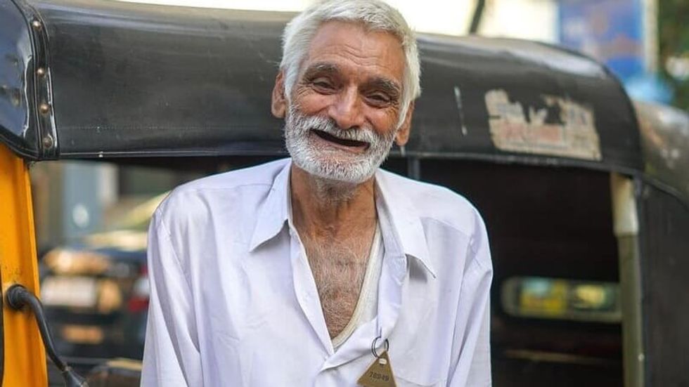 an elderly man smiling