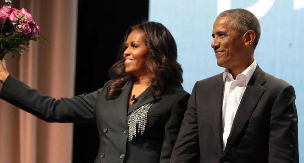 Michelle and Barack Obama on stage discussing her new book on marriage and more.