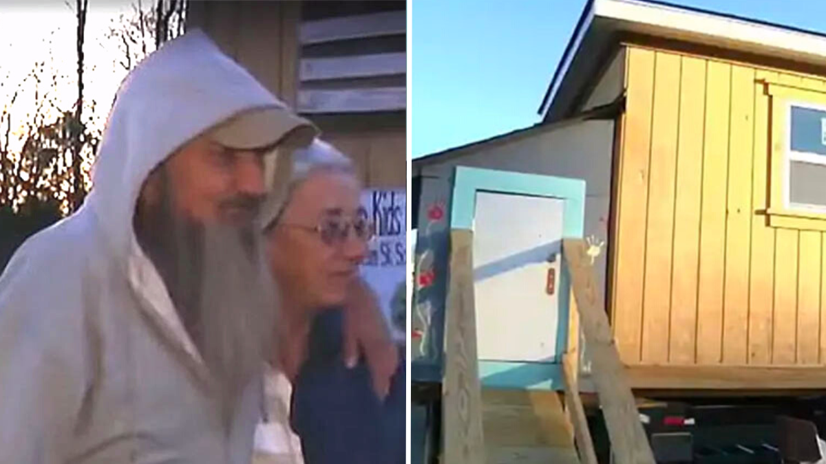 man and woman in hoodies and a tiny house