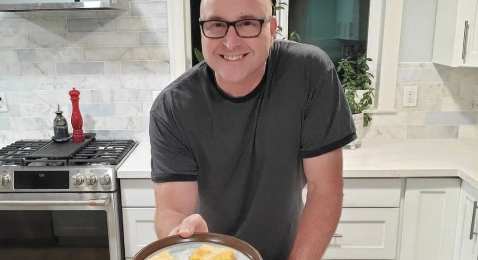 Kenney showing how to make an egg omelette. 
