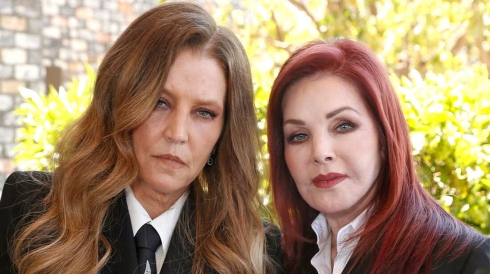 Lisa Marie Presley posing with mother Priscilla.