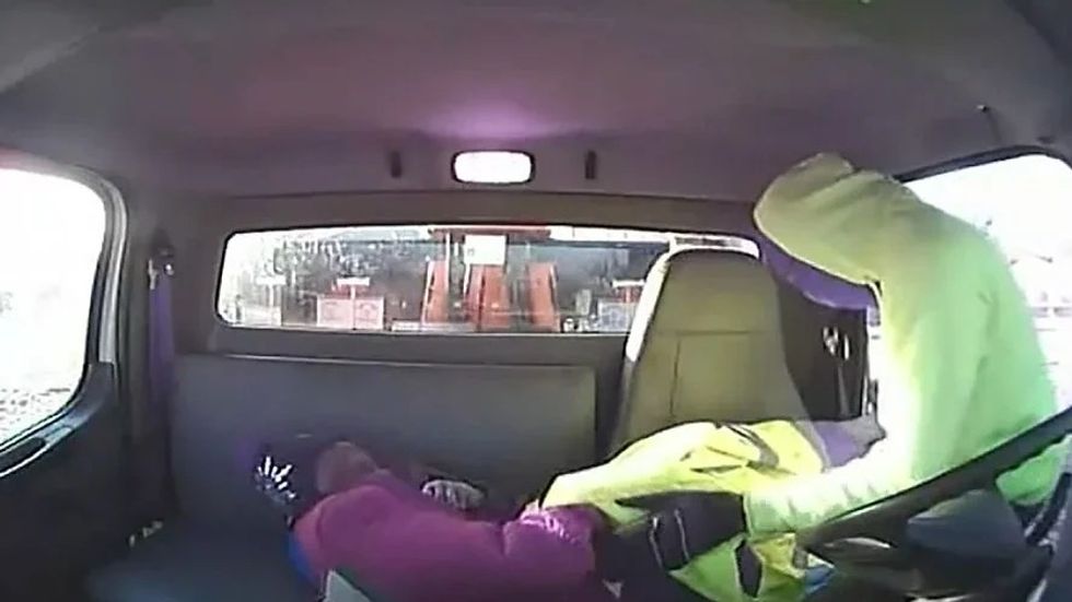 footage of man laying elderly woman in the backseat of truck