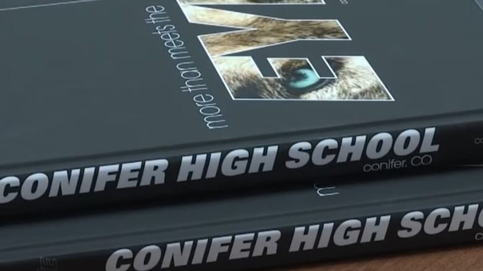 two yearbooks stacked on top of each other