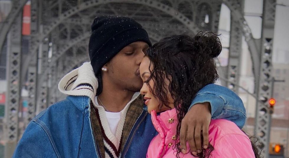 Asap Rocky kissing a pregnant Rihanna.