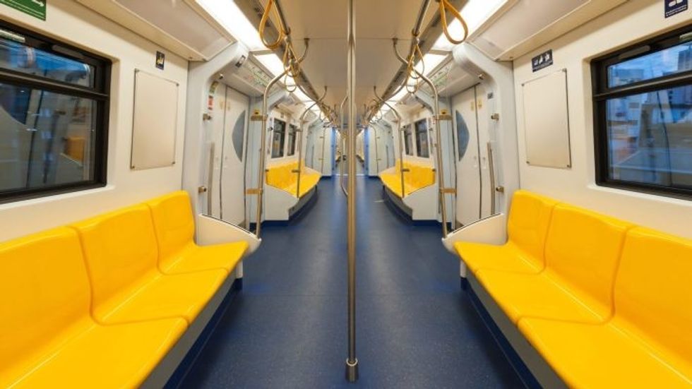 yellow seats on empty subway