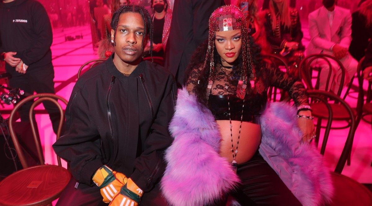 A$AP Rocky and a pregnant Rihanna posing at an awards show.