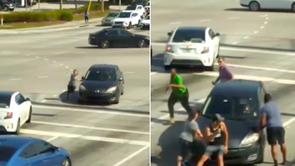 Strangers Spring Into Action to Save a Driver in Crisis on a Busy Road [VIDEO]