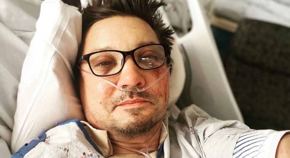 Jeremy Renner laying in a hospital bed after snowplow accident.